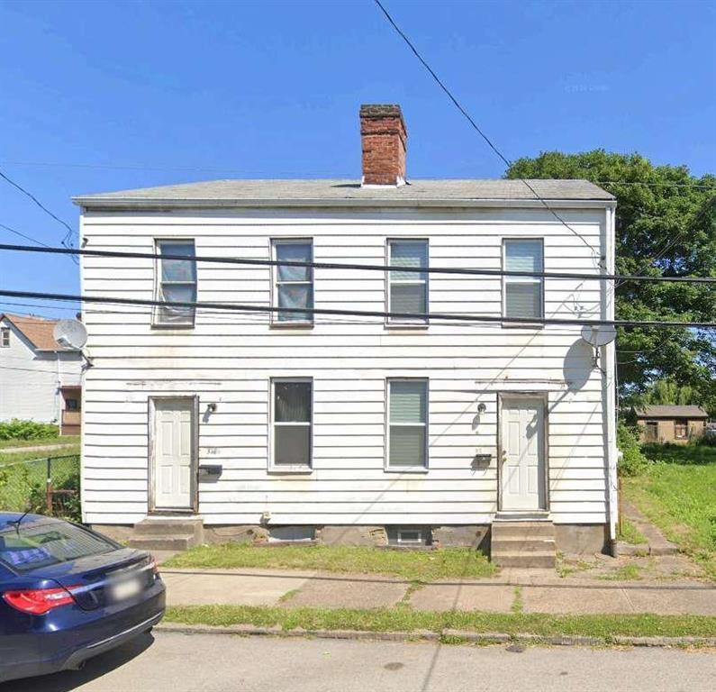 316-318 Tabor Street Pittsburgh, PA 15204 - Photo 1 of 15 a front view of a house with a yard