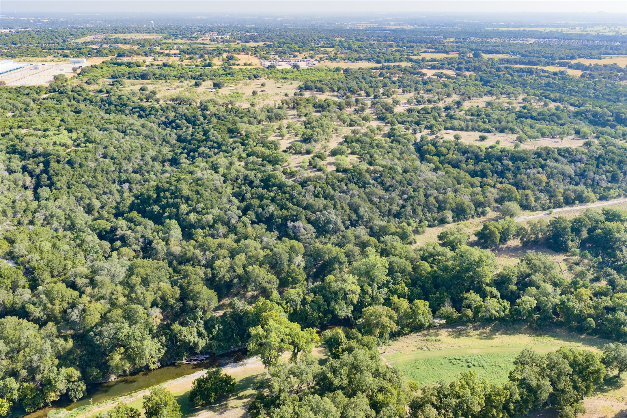 4170 Elm Grove Road Belton, TX 76513 - Photo 30 of 35 Mature woodlands and open meadows line a gentle watercourse in this sprawling countryside landscape.