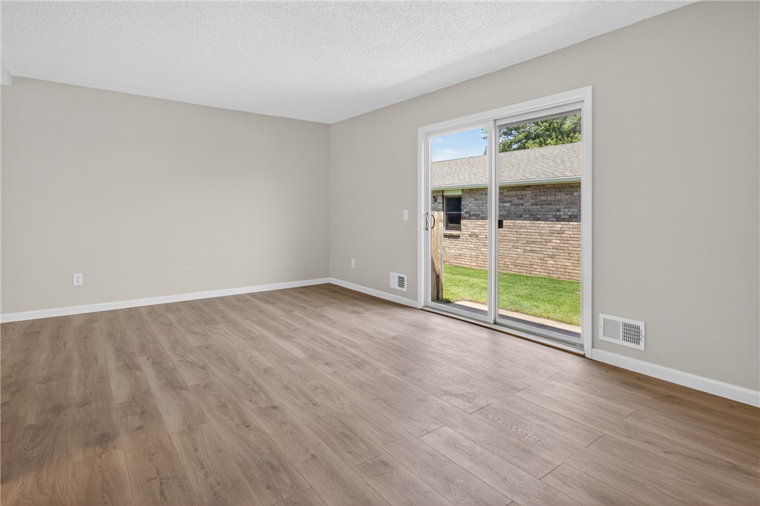 561 French Road Brighton, NY 14618 - Photo 11 of 45 SLIDER LEADING TO THE BACK PATIO AREA AND PEOPLE D
