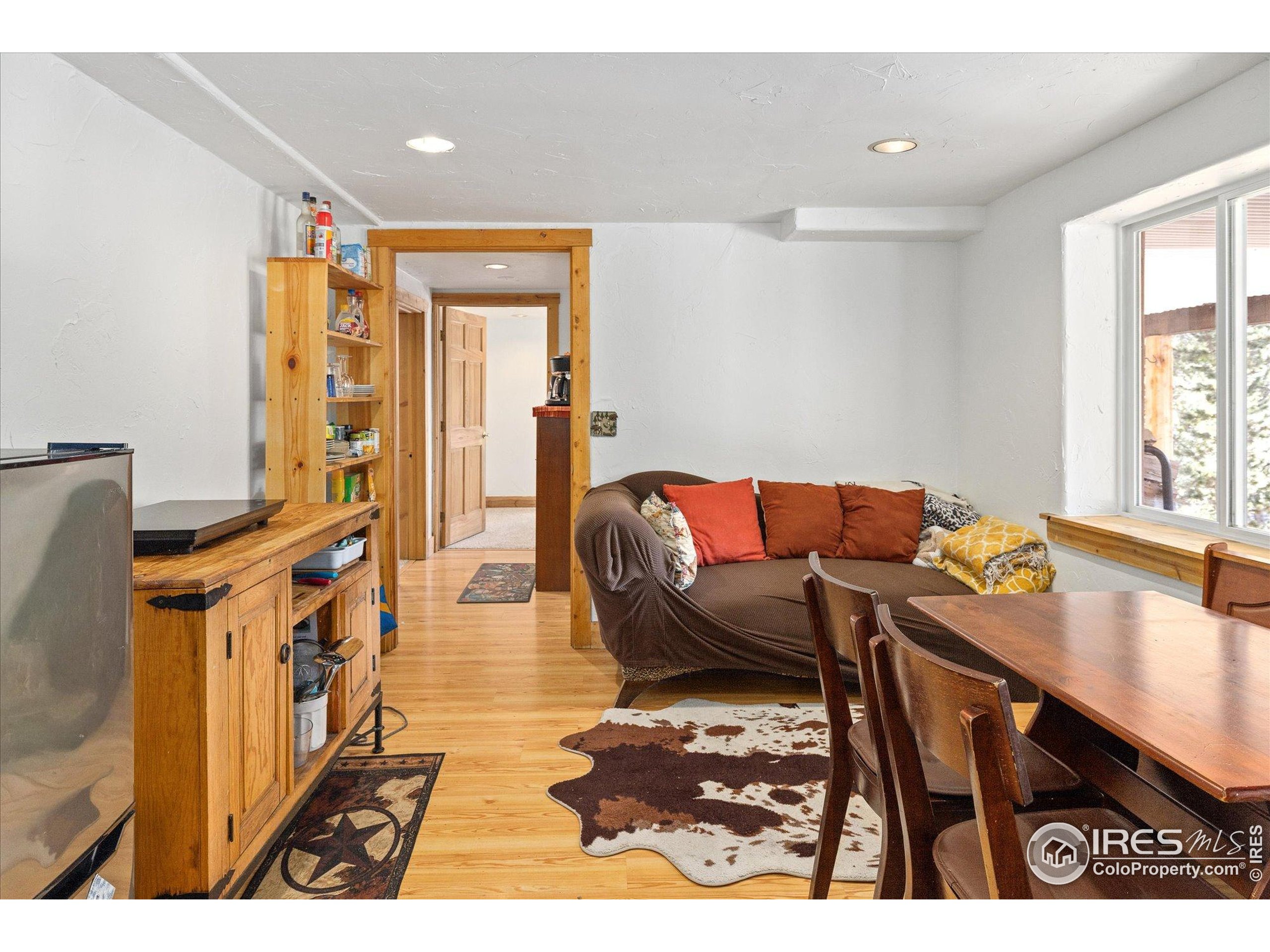 246 Rudi Lane West Golden, CO 80403 - Photo 22 of 48 a living room with furniture and a table