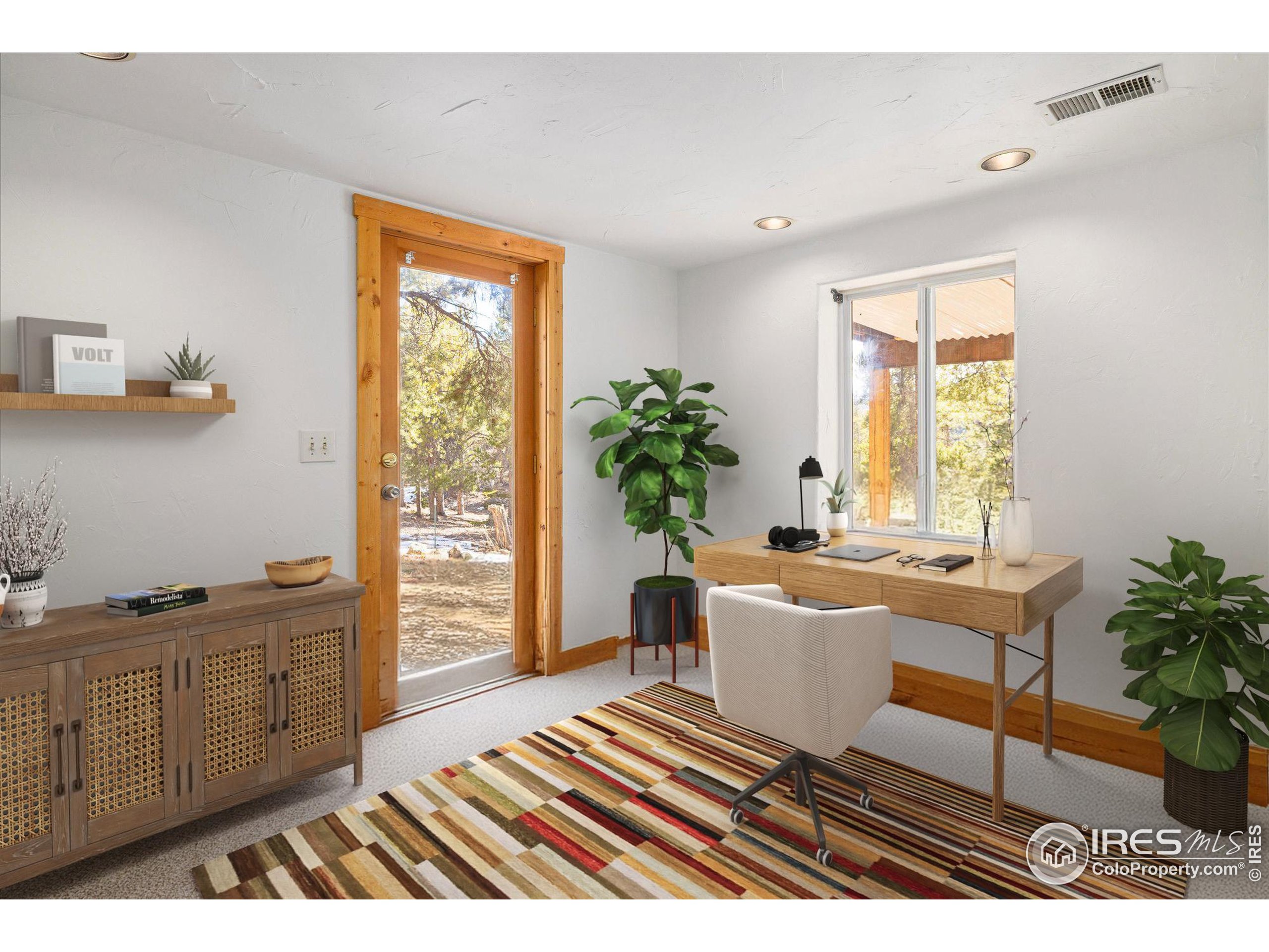246 Rudi Lane West Golden, CO 80403 - Photo 26 of 48 a living room with furniture a window and a potted plant