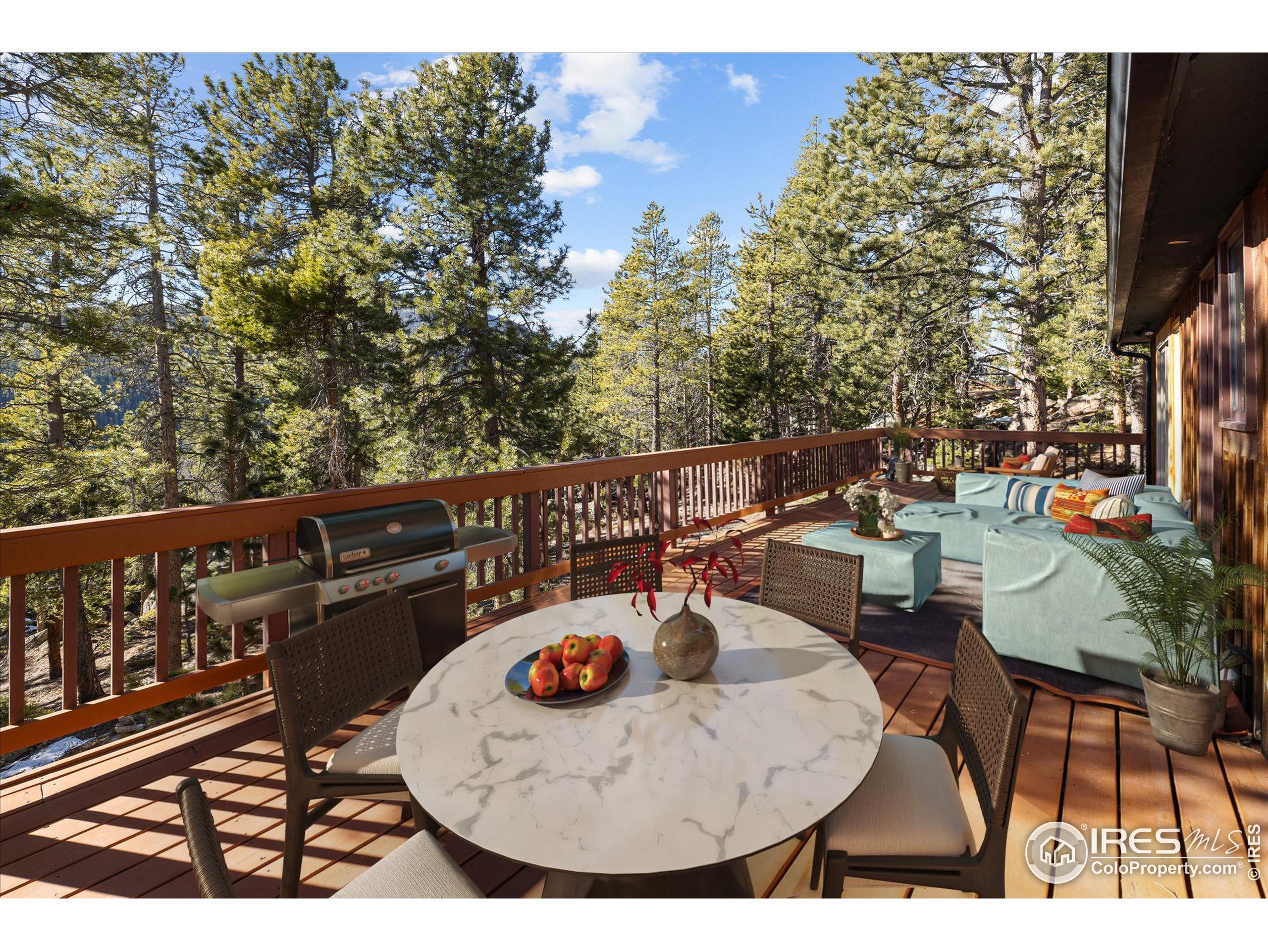 246 Rudi Lane West Golden, CO 80403 - Photo 29 of 48 a view of a chairs and table on the deck