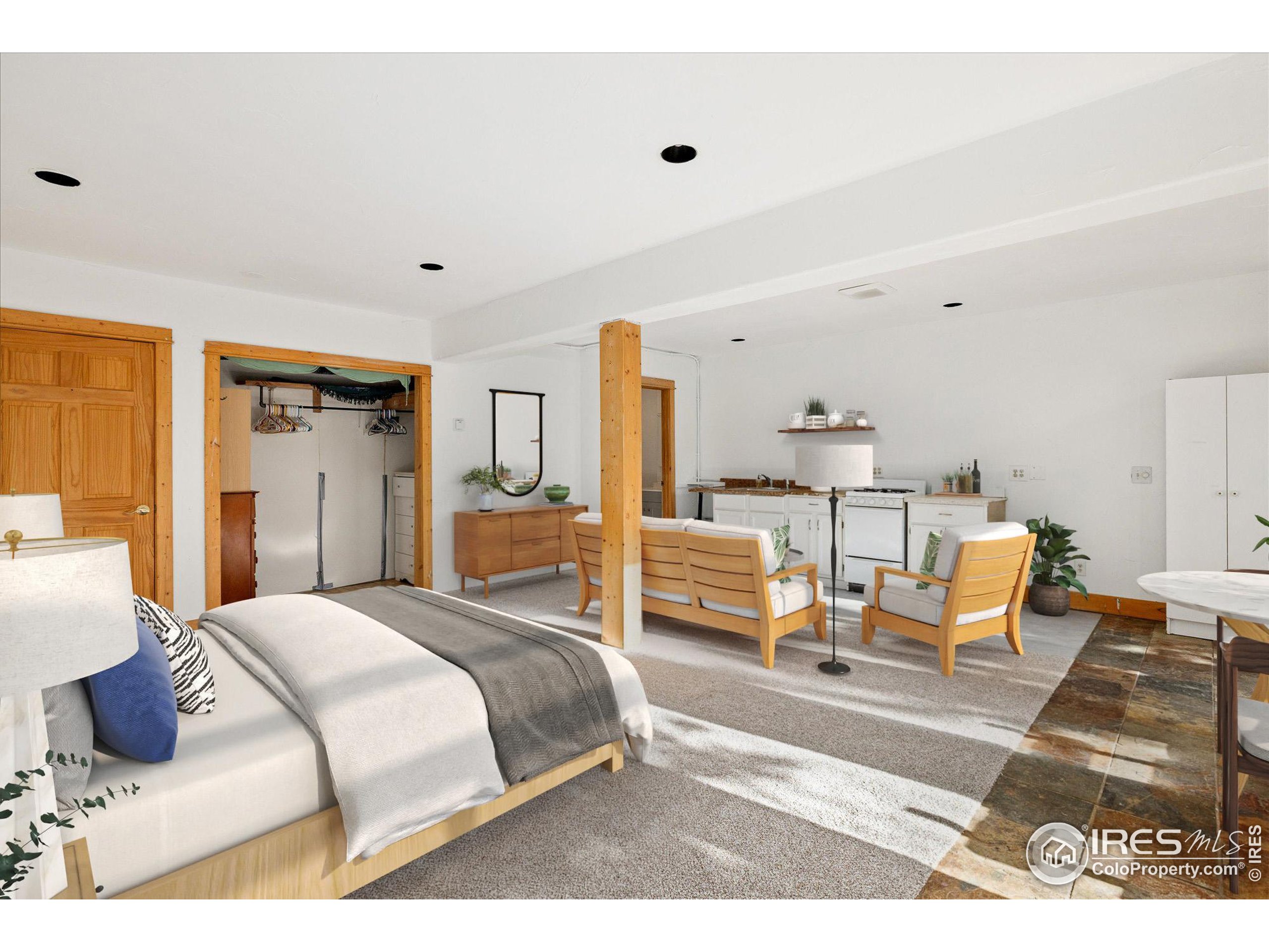 246 Rudi Lane West Golden, CO 80403 - Photo 34 of 48 a bedroom with a bed and wooden floor