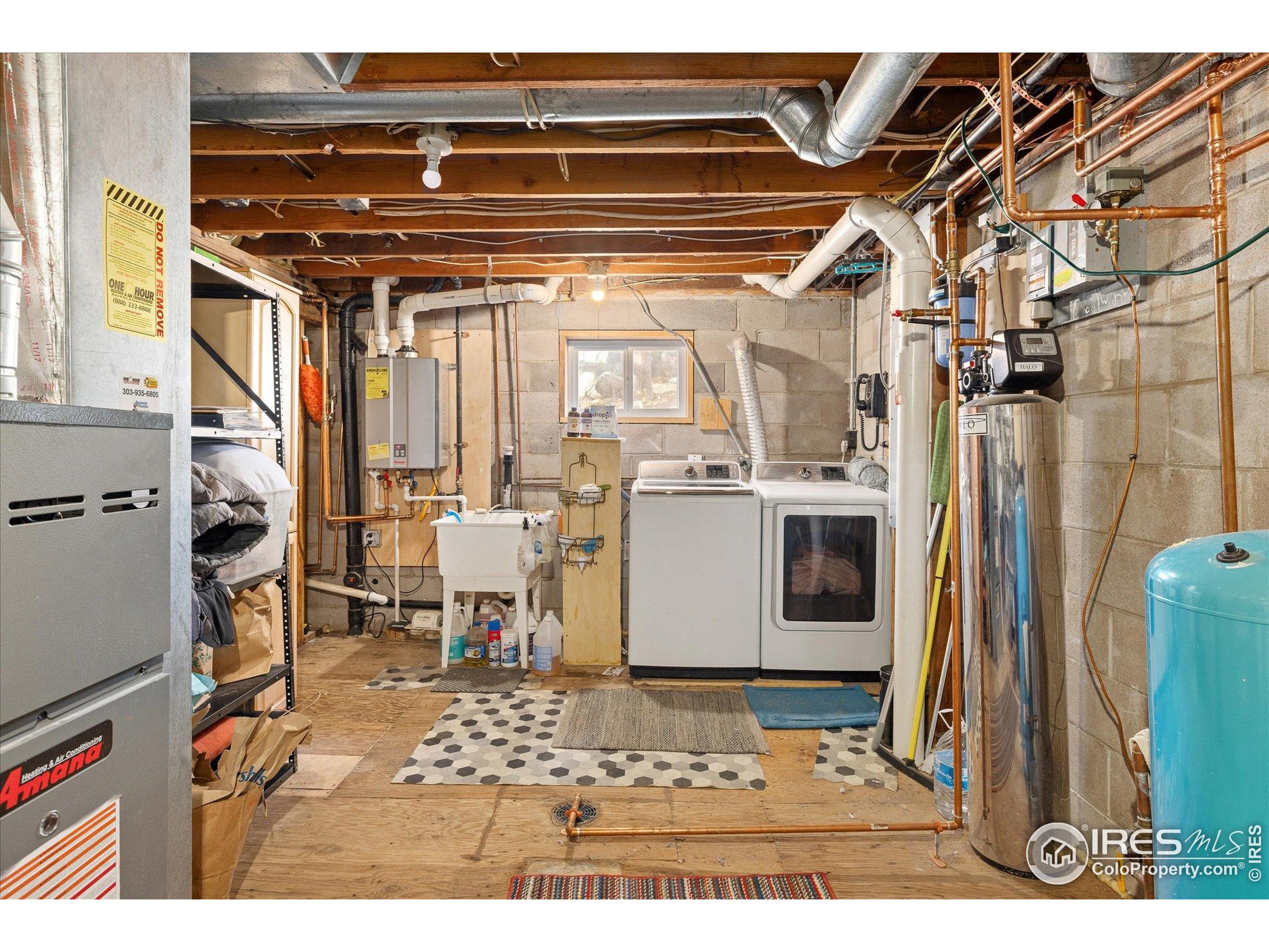 246 Rudi Lane West Golden, CO 80403 - Photo 43 of 48 a view of a refrigerator with wooden floor