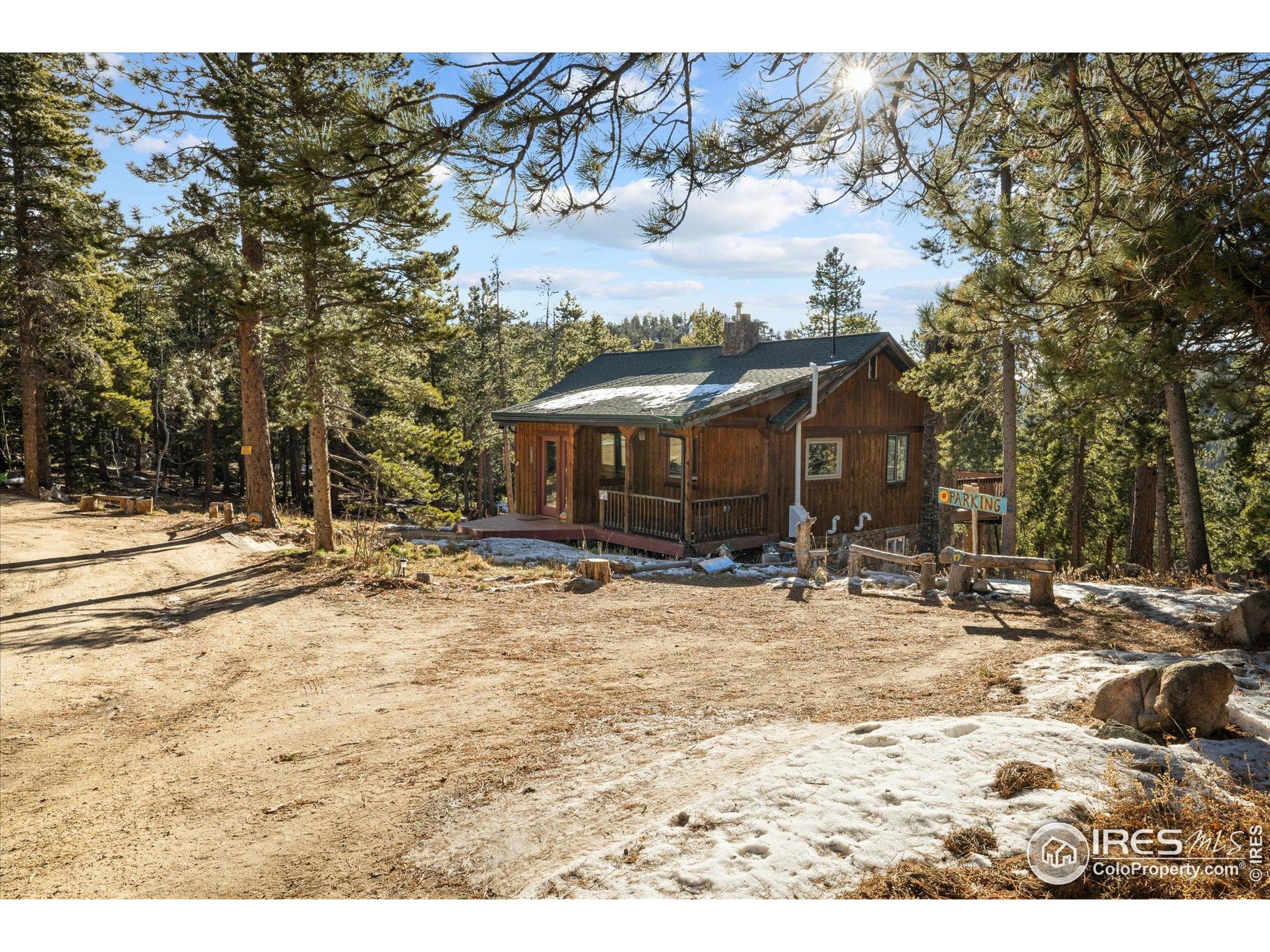246 Rudi Lane West Golden, CO 80403 - Photo 7 of 48 a view of a house with a yard covered in snow