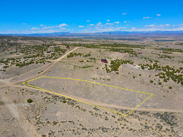 11714 South Coulton Road, Unit 12 Duchesne, UT 84021 - Photo 3 of 8 Overview of rural landscape featuring a mountain backdrop and property parcel outlined