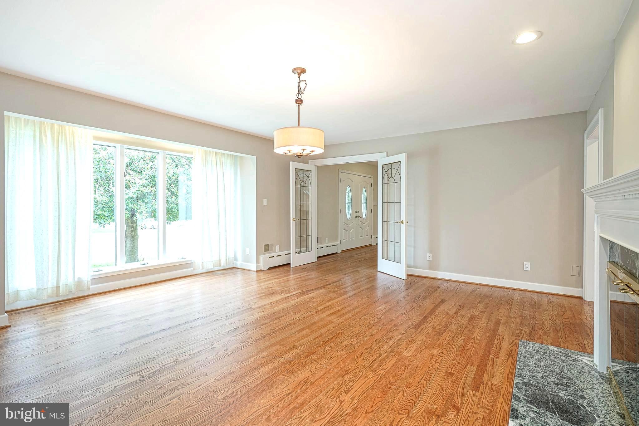 1056 Chews Landing Road Clementon, NJ 08021 - Photo 14 of 55 a view of an empty room with wooden floor and a window