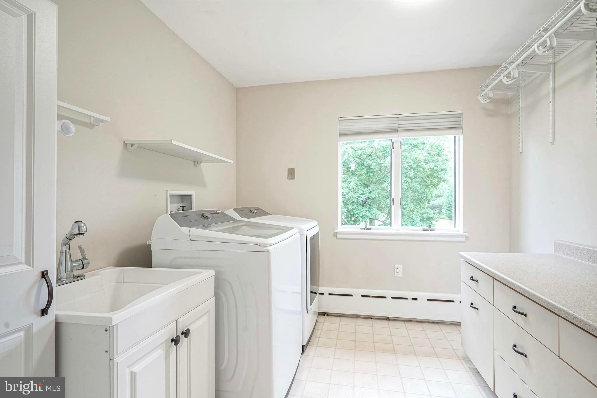 1056 Chews Landing Road Clementon, NJ 08021 - Photo 41 of 55 a utility room with cabinets washer and dryer