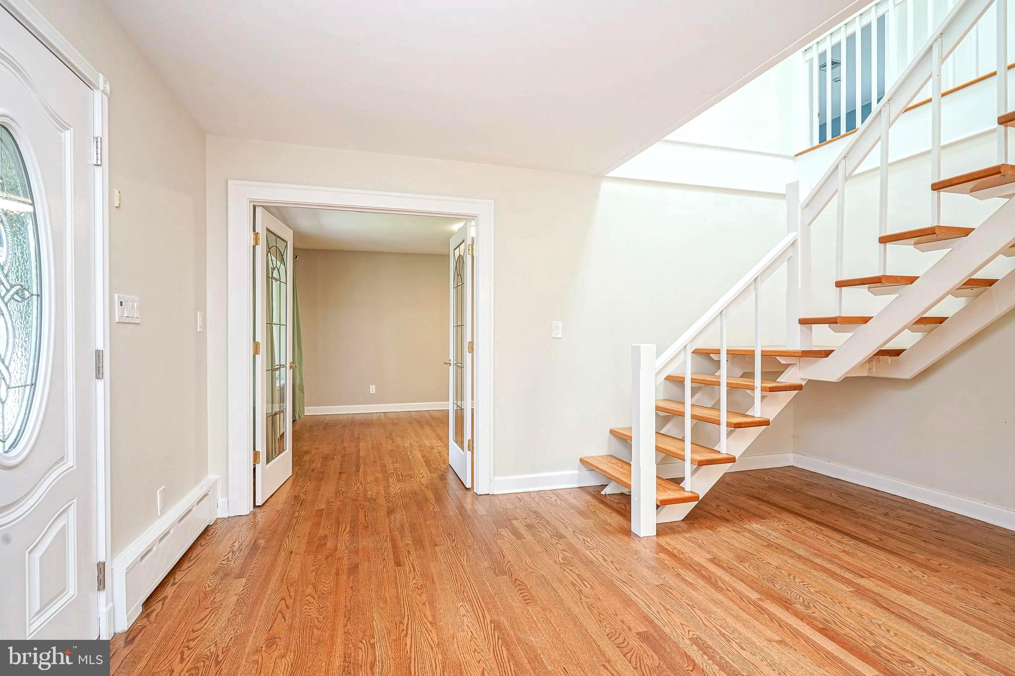 1056 Chews Landing Road Clementon, NJ 08021 - Photo 7 of 55 a view of entryway with wooden floor and stairs
