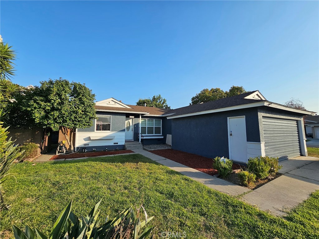 6502 Dos Rios Road Downey, CA 90240 - Photo 1 of 20 a view of a house with garden and yard