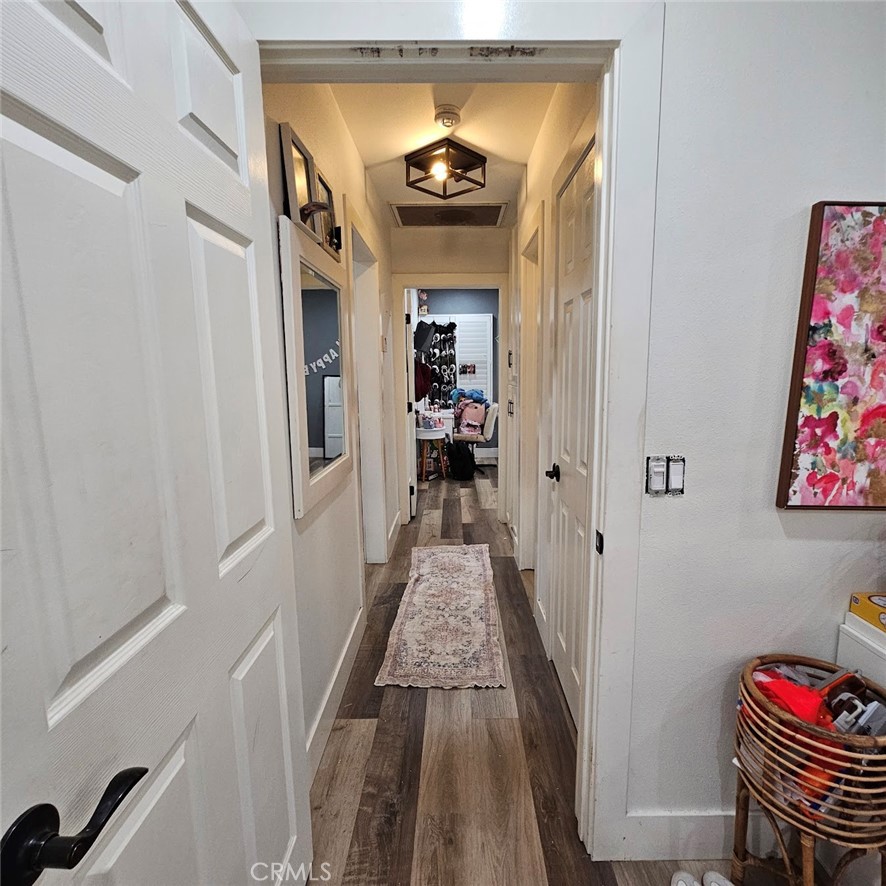 6502 Dos Rios Road Downey, CA 90240 - Photo 18 of 20 a hallway with wooden floor and workspace