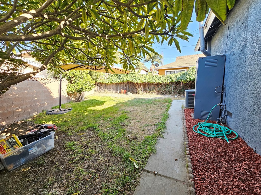 6502 Dos Rios Road Downey, CA 90240 - Photo 3 of 20 a backyard of a house with lots of green space