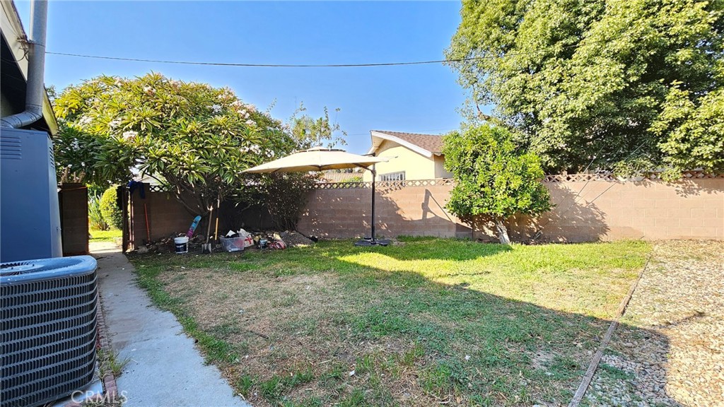 6502 Dos Rios Road Downey, CA 90240 - Photo 4 of 20 a view of a backyard with plants and a garden