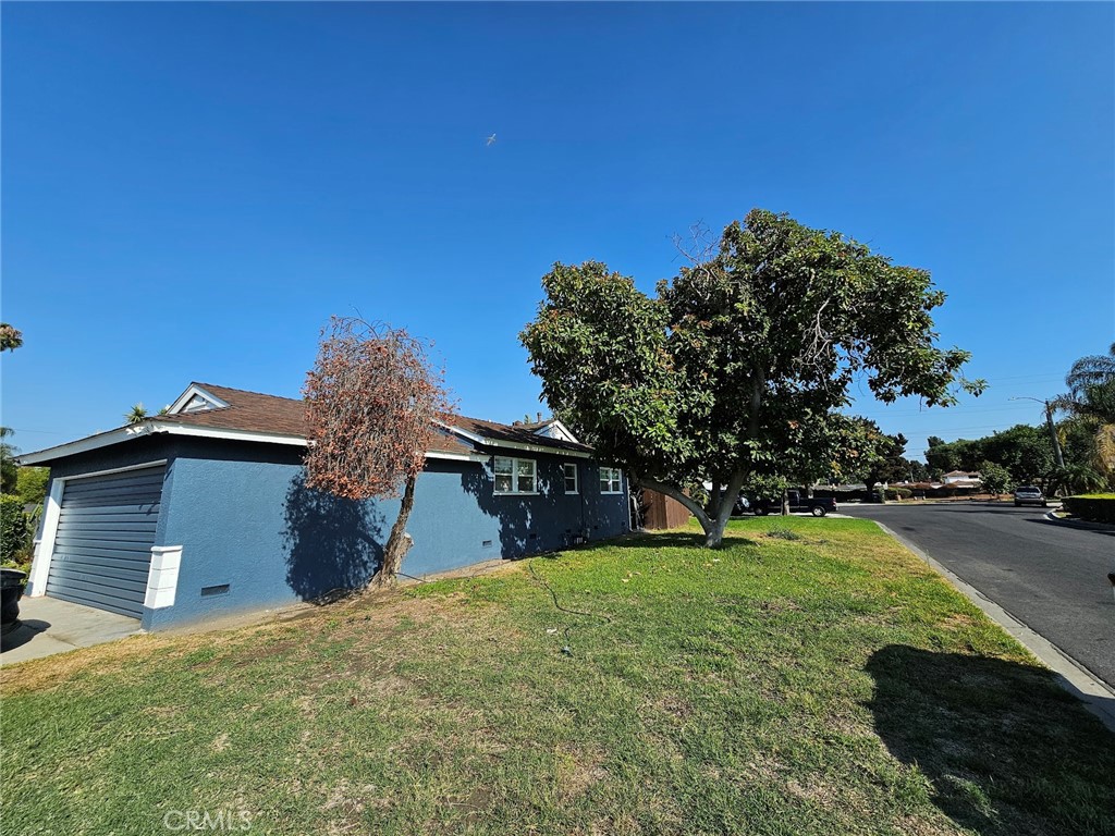 6502 Dos Rios Road Downey, CA 90240 - Photo 6 of 20 a house view with a garden space