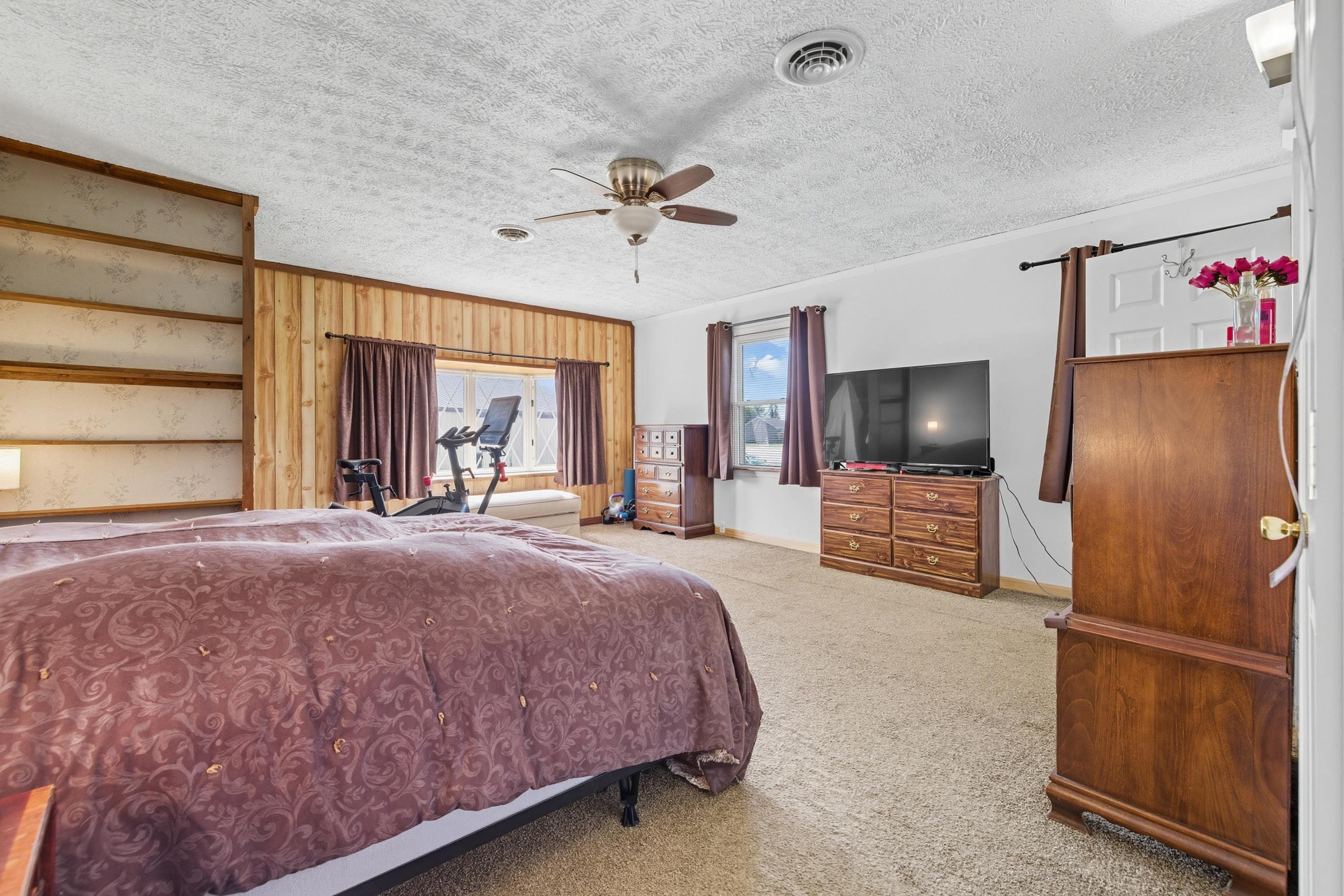 9108 Nazarene Church Road Bridgewater, VA 22812 - Photo 12 of 72 a spacious bedroom with a bed and a flat screen tv