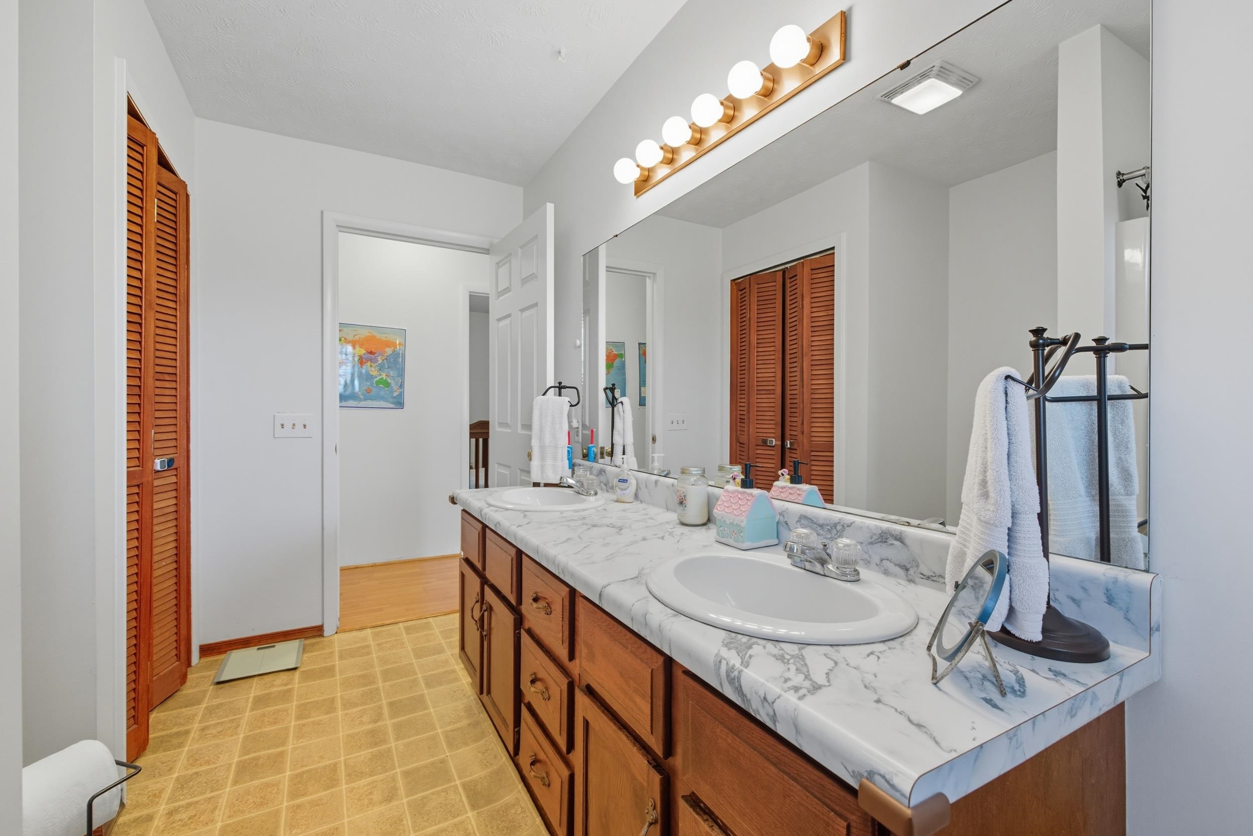 9108 Nazarene Church Road Bridgewater, VA 22812 - Photo 19 of 72 a bathroom with a sink double vanity and a mirror