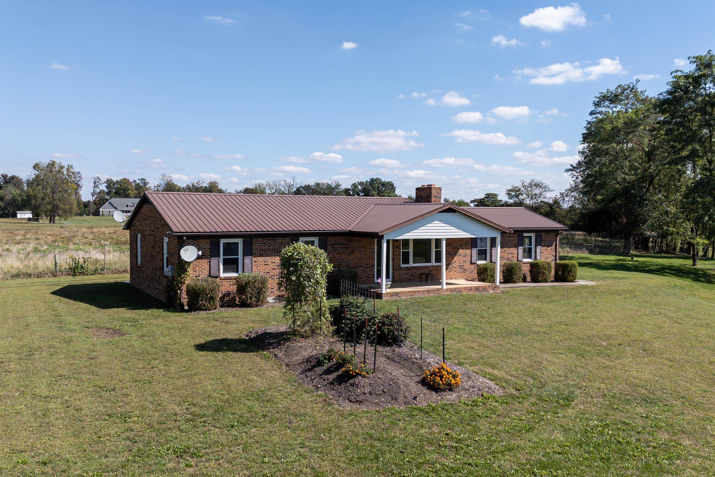 9108 Nazarene Church Road Bridgewater, VA 22812 - Photo 28 of 72 a front view of a house with garden