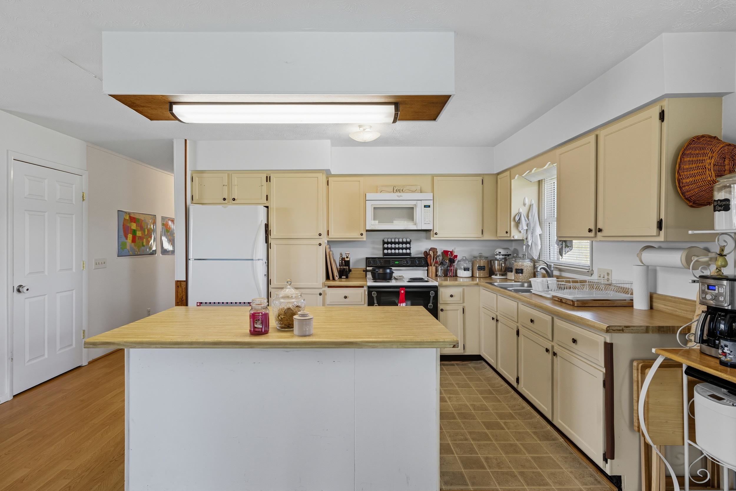 9108 Nazarene Church Road Bridgewater, VA 22812 - Photo 3 of 72 a kitchen with stainless steel appliances a stove refrigerator sink and cabinets