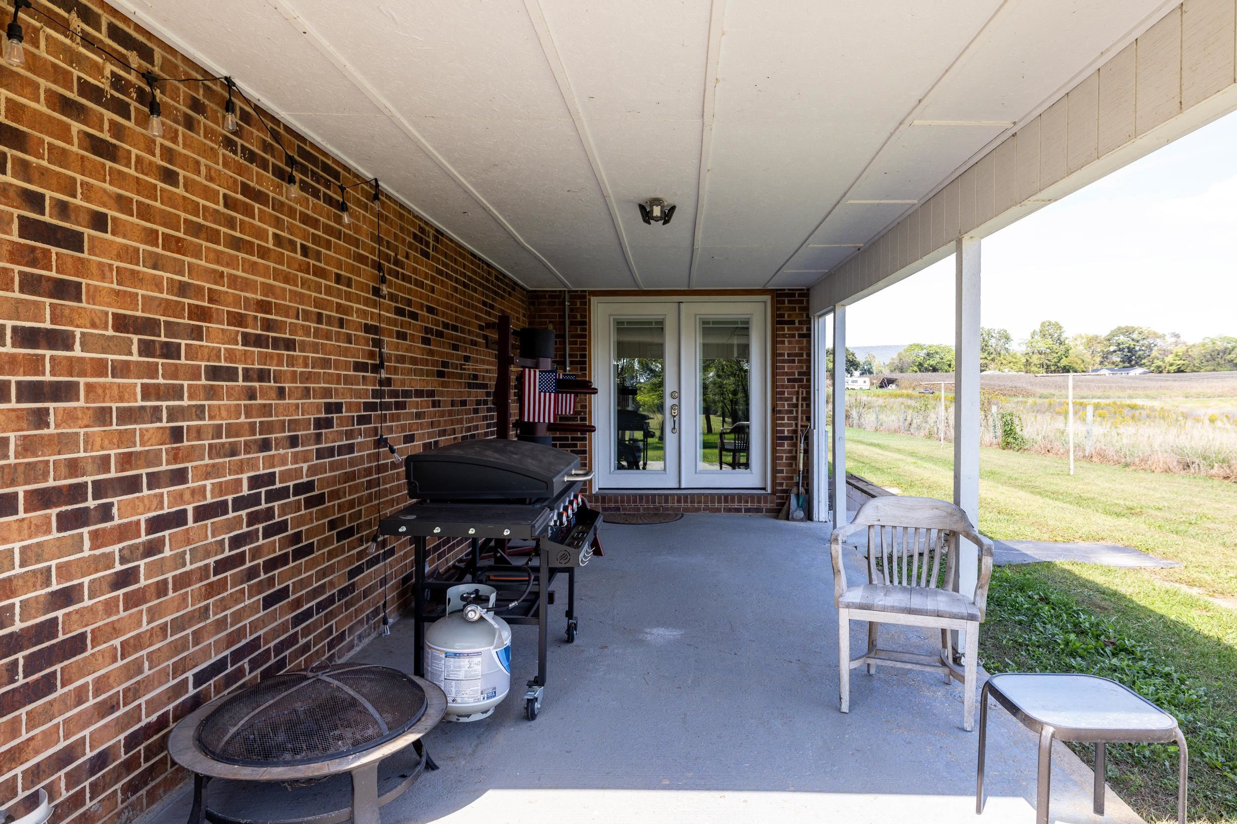 9108 Nazarene Church Road Bridgewater, VA 22812 - Photo 42 of 72 a work room with furniture and a floor to ceiling window
