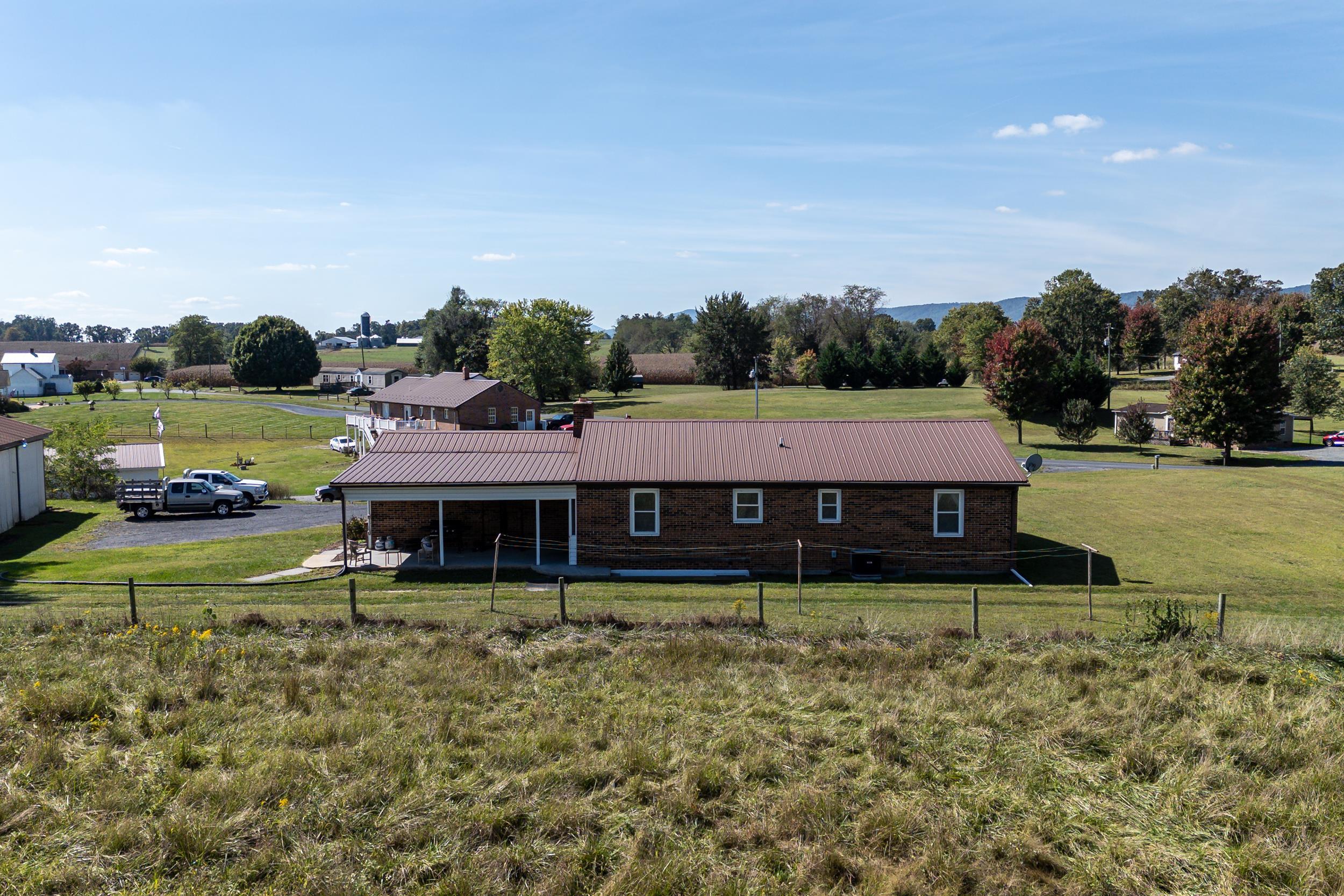 9108 Nazarene Church Road Bridgewater, VA 22812 - Photo 45 of 72 a aerial view of a house with a yard and lake view