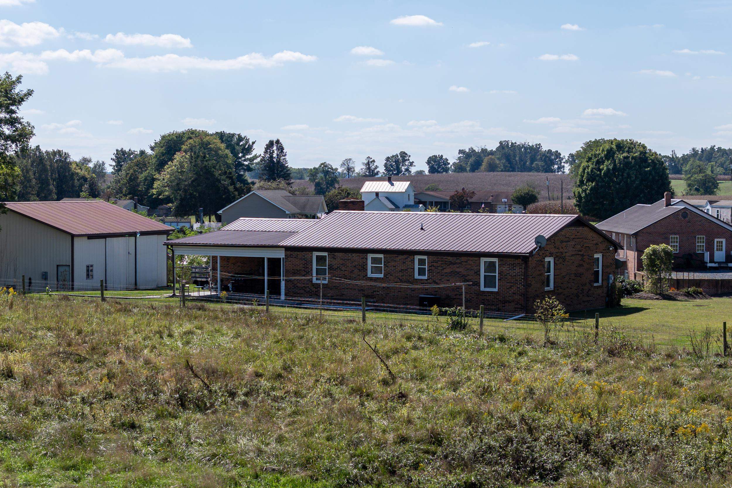 9108 Nazarene Church Road Bridgewater, VA 22812 - Photo 48 of 72 a large house with a big yard and large trees