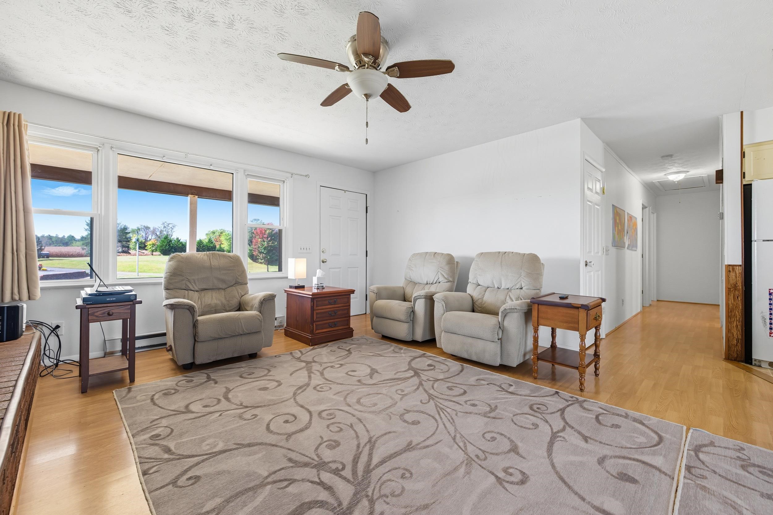 9108 Nazarene Church Road Bridgewater, VA 22812 - Photo 8 of 72 a living room with furniture and a large window with wooden floor