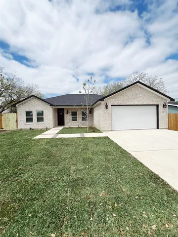 a house view with a garden space