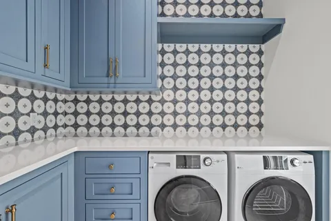 a kitchen with stainless steel appliances granite countertop a stove and a sink