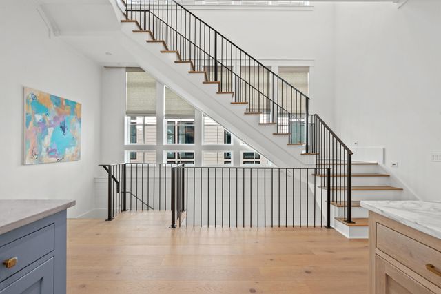 a spacious bedroom with a bed and a window