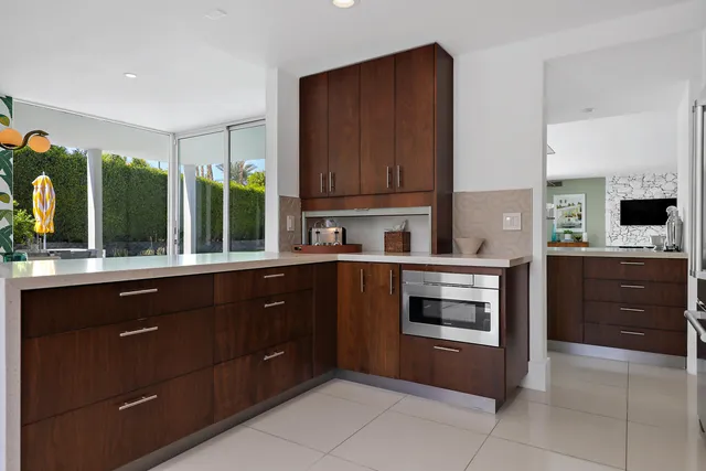 a kitchen with a sink and a stove top oven