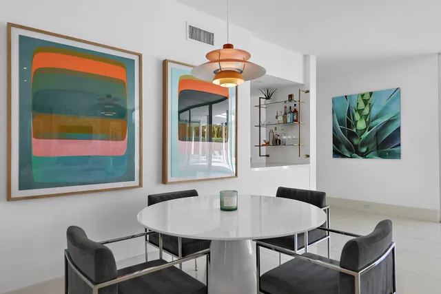 a dining room with furniture and window