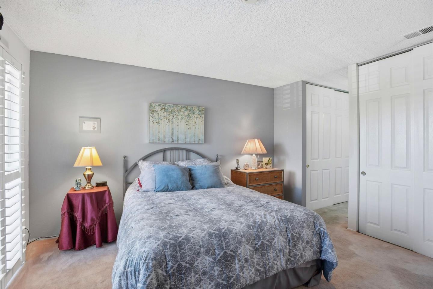 815 Rigel Lane Foster City, CA 94404 - Photo 23 of 48 a bedroom with a bed and a lamp