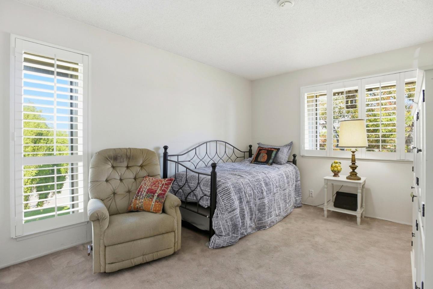815 Rigel Lane Foster City, CA 94404 - Photo 26 of 48 a spacious bedroom with a bed and a couch
