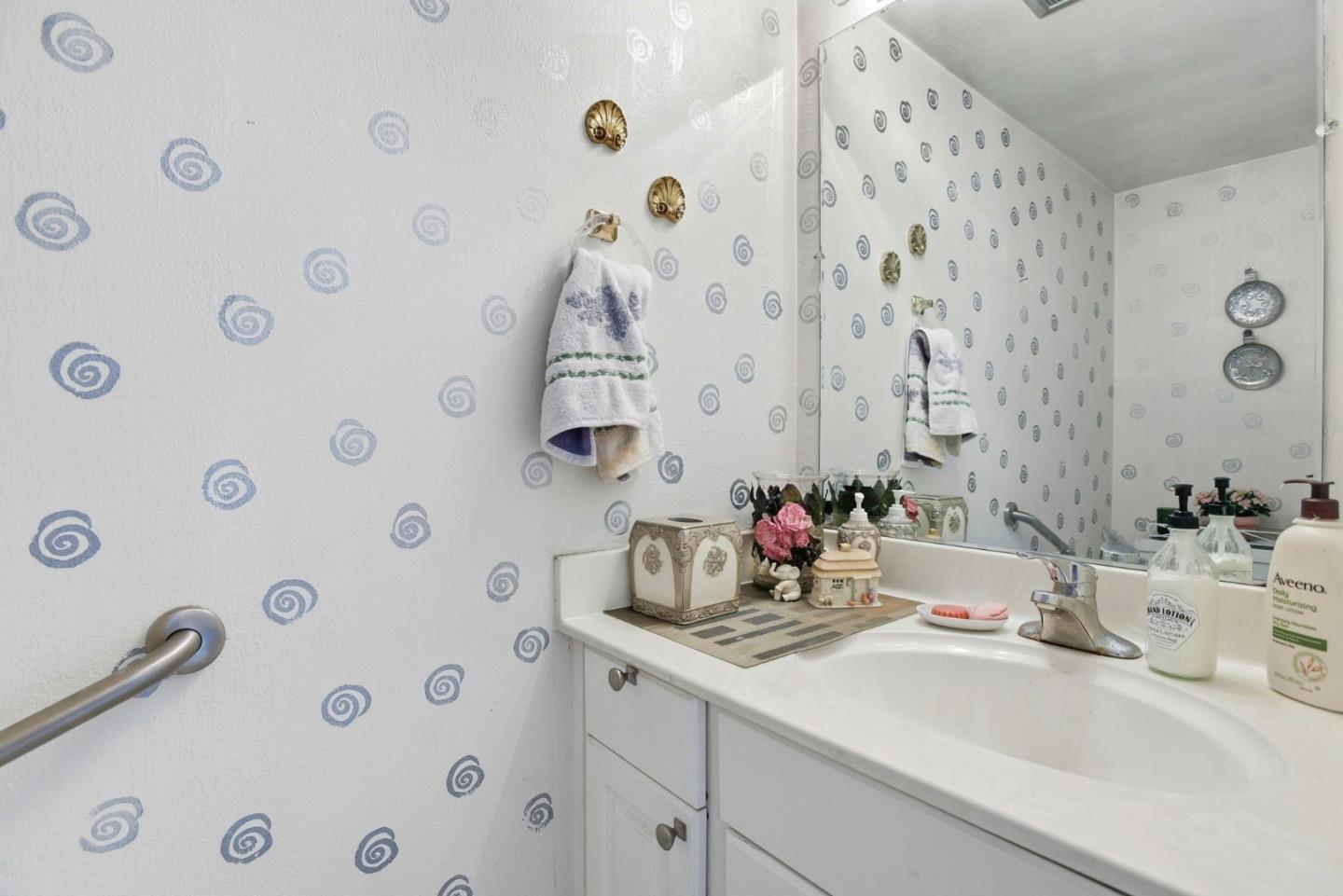 815 Rigel Lane Foster City, CA 94404 - Photo 29 of 48 a bathroom with a sink and a mirror