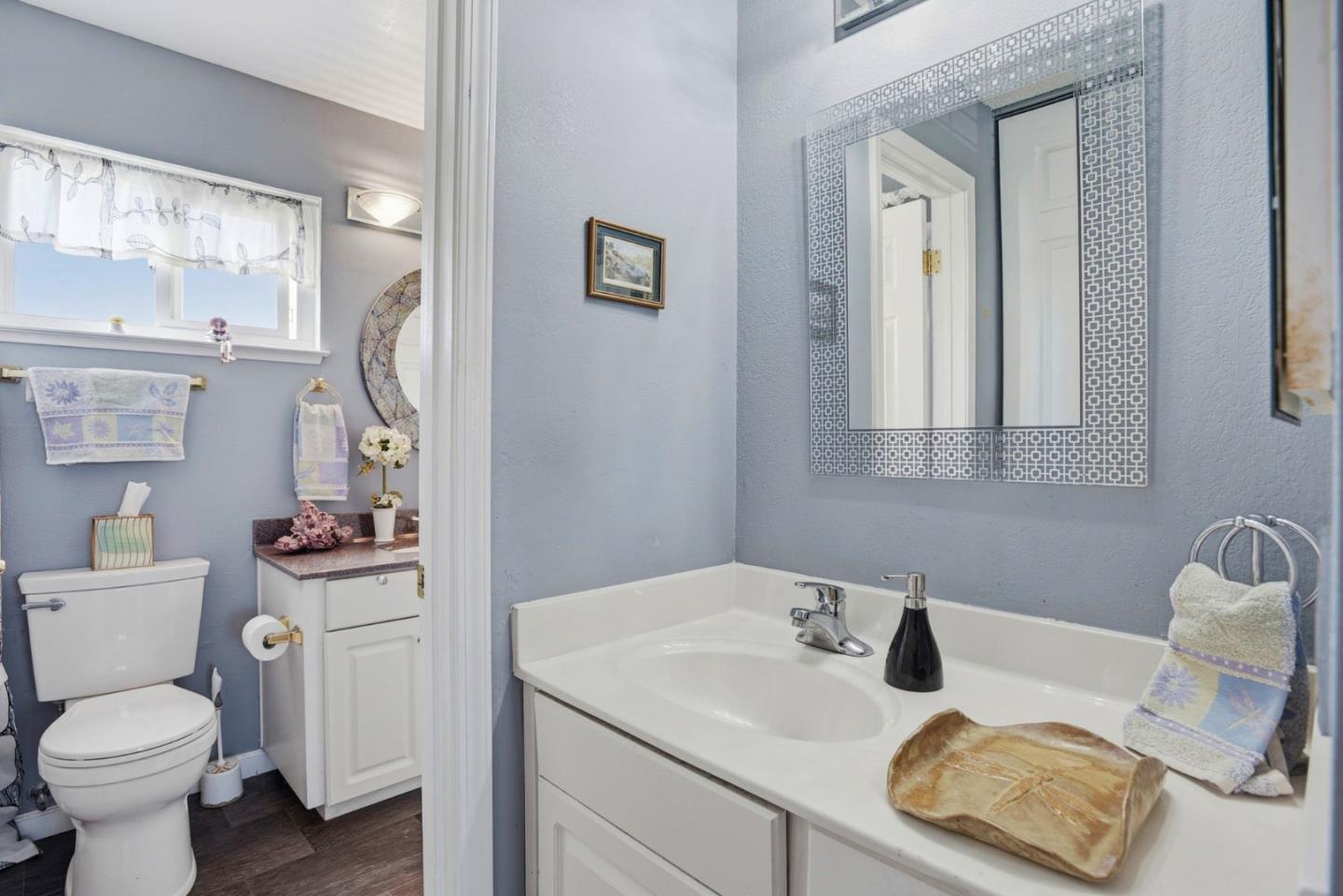 815 Rigel Lane Foster City, CA 94404 - Photo 32 of 48 a bathroom with a sink toilet vanity and mirror