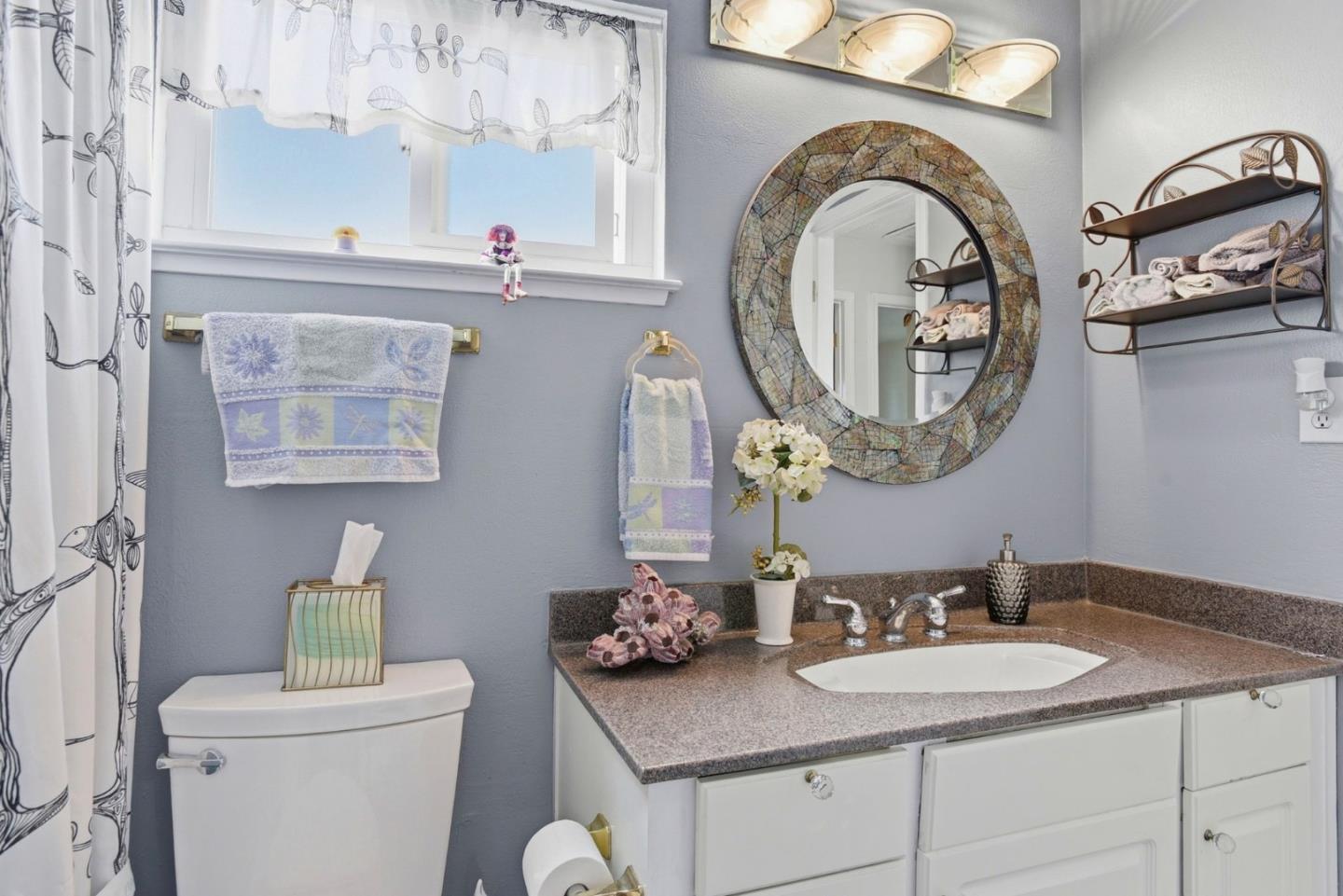 815 Rigel Lane Foster City, CA 94404 - Photo 33 of 48 a bathroom with a granite countertop toilet a sink and a mirror