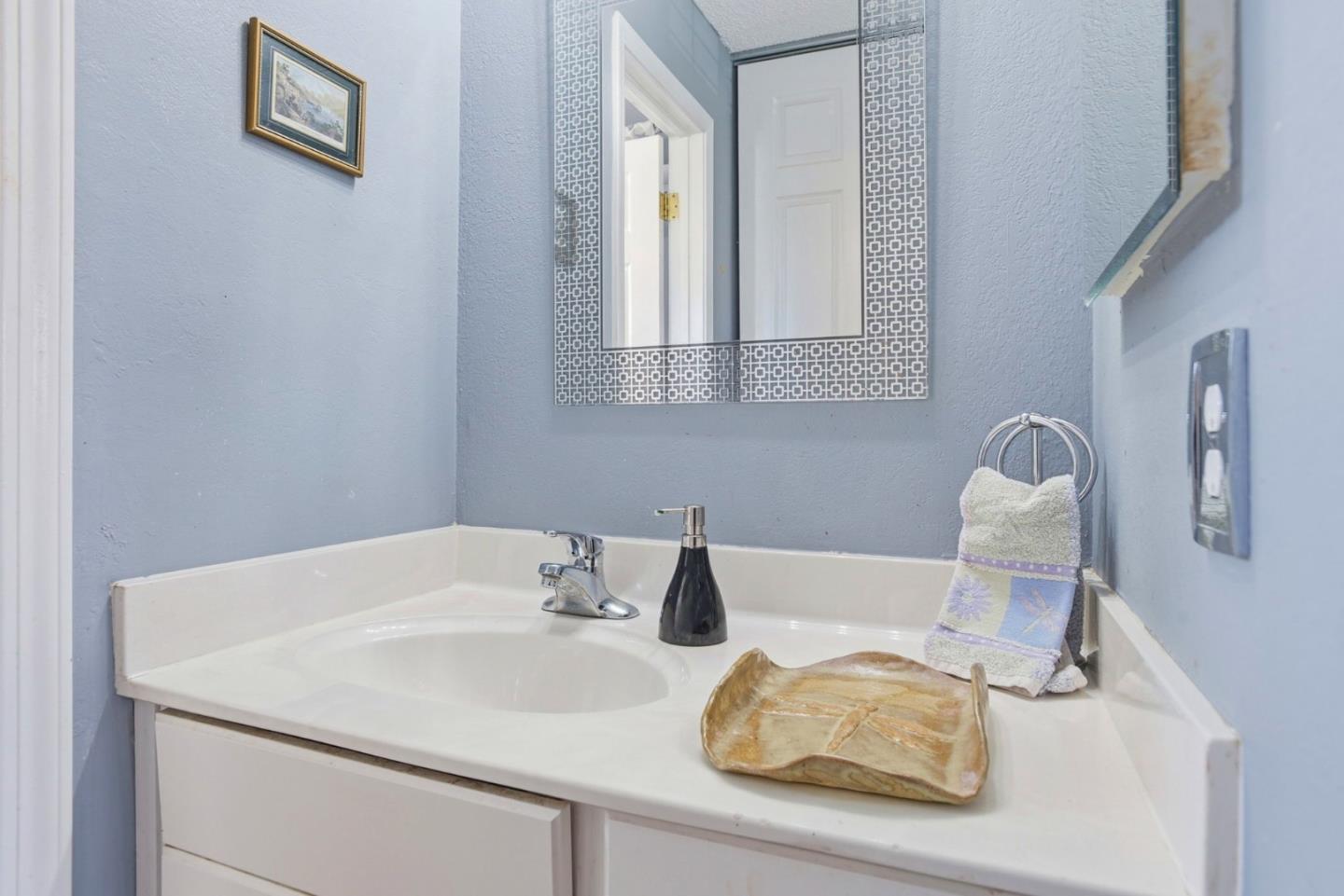 815 Rigel Lane Foster City, CA 94404 - Photo 34 of 48 a bathroom with a sink and a mirror
