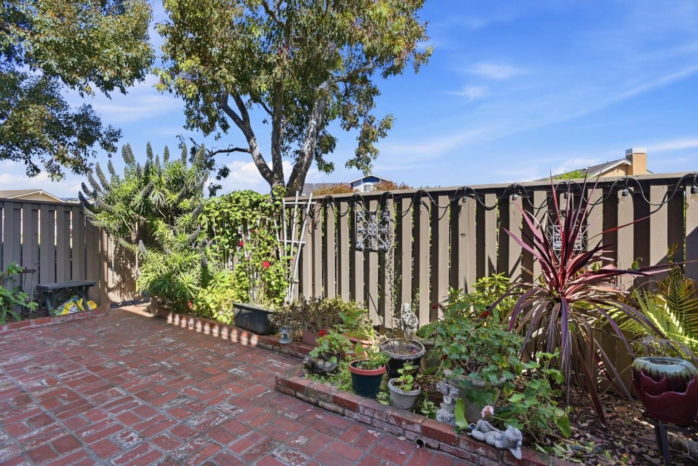 815 Rigel Lane Foster City, CA 94404 - Photo 39 of 48 a street view with flower garden