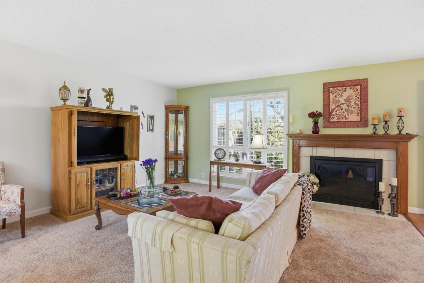 815 Rigel Lane Foster City, CA 94404 - Photo 7 of 48 a living room with furniture and a fireplace