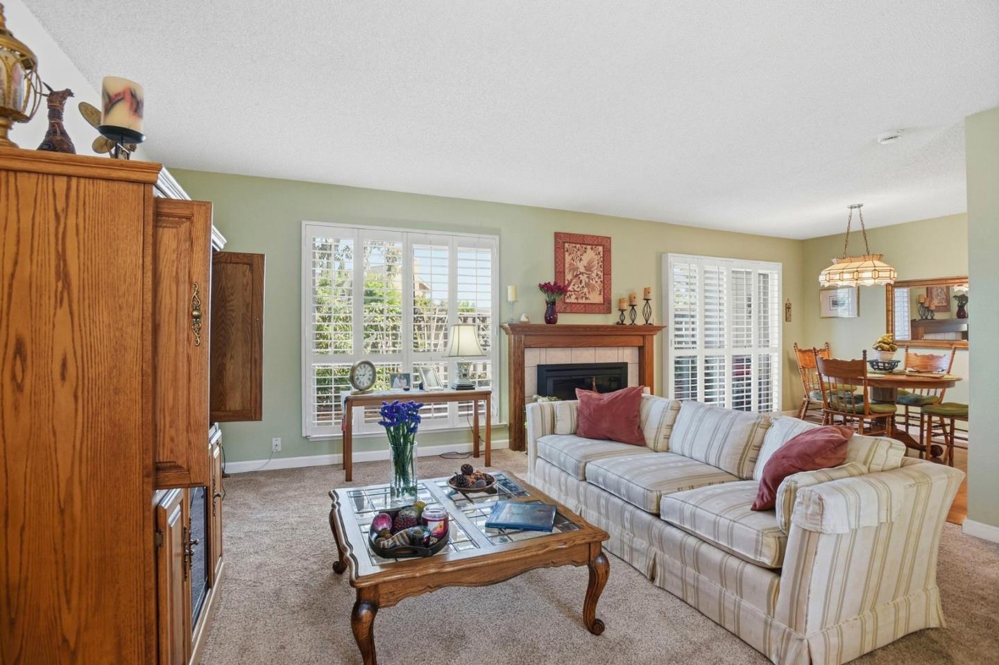 815 Rigel Lane Foster City, CA 94404 - Photo 8 of 48 a living room with furniture a fireplace and large windows