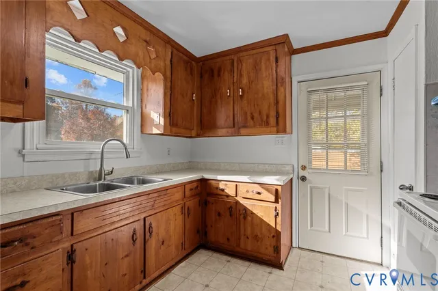 a kitchen with stainless steel appliances a stove and a microwave