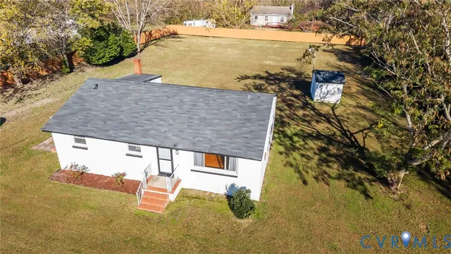 an aerial view of houses with yard