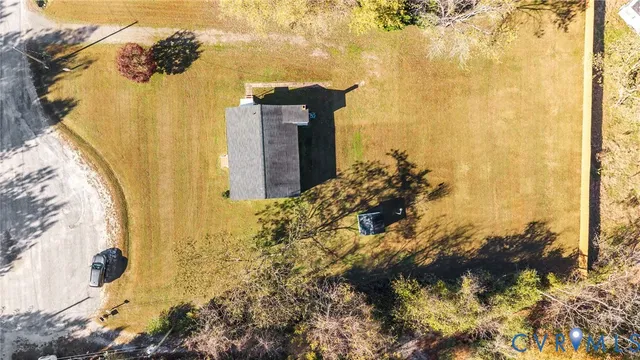 a view of yard with large trees