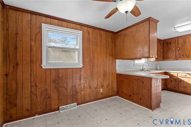 a view of a utility room with closet and windows