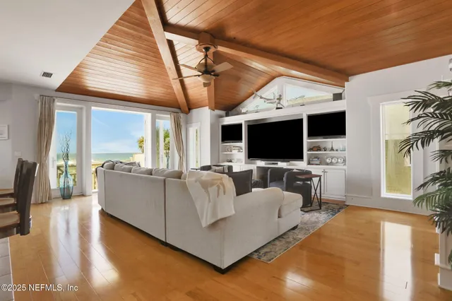 a kitchen with granite countertop stainless steel appliances a sink window and cabinets