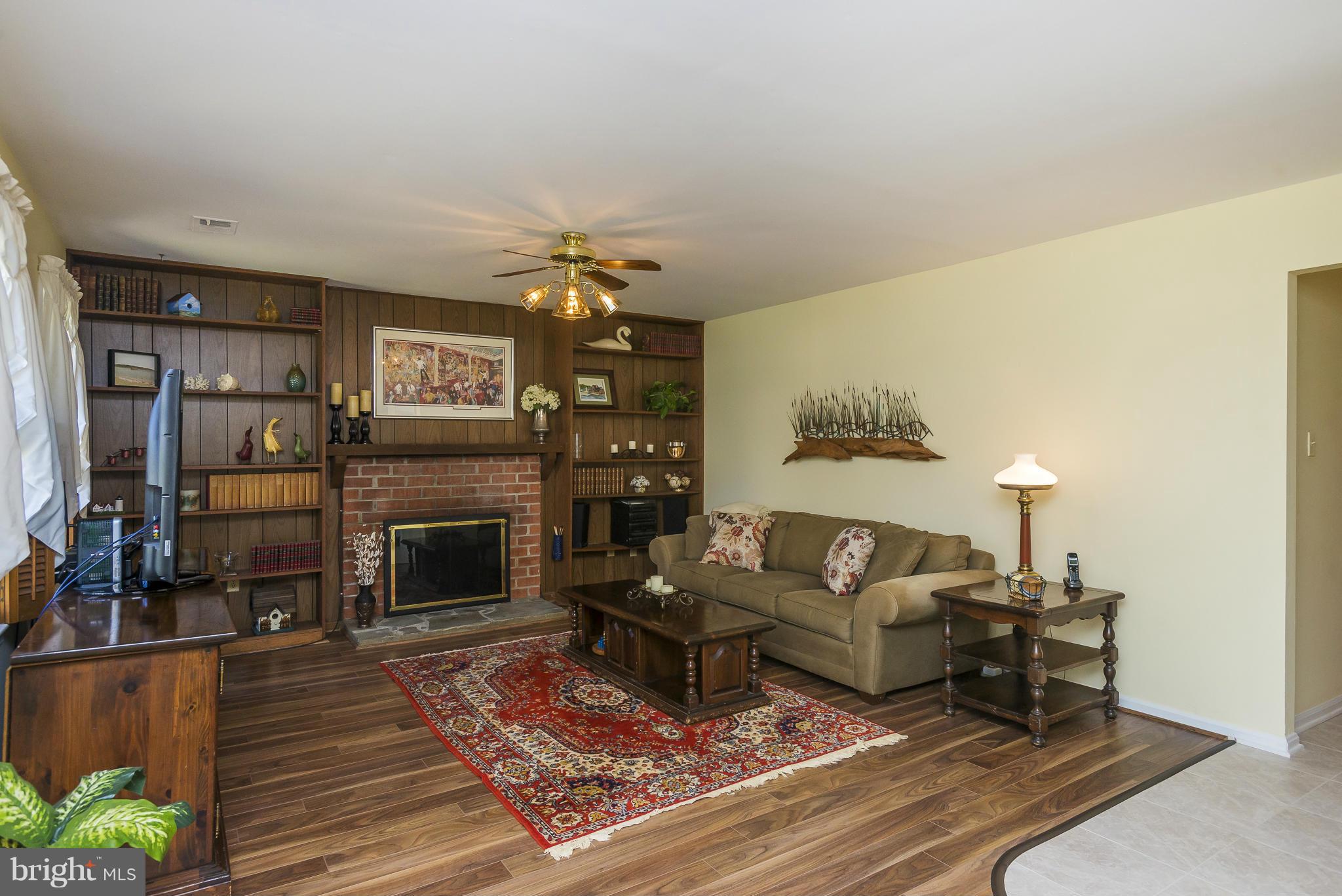 5054 Whetstone Road Columbia, MD 21044 - Photo 13 of 30 a living room with furniture and a fireplace