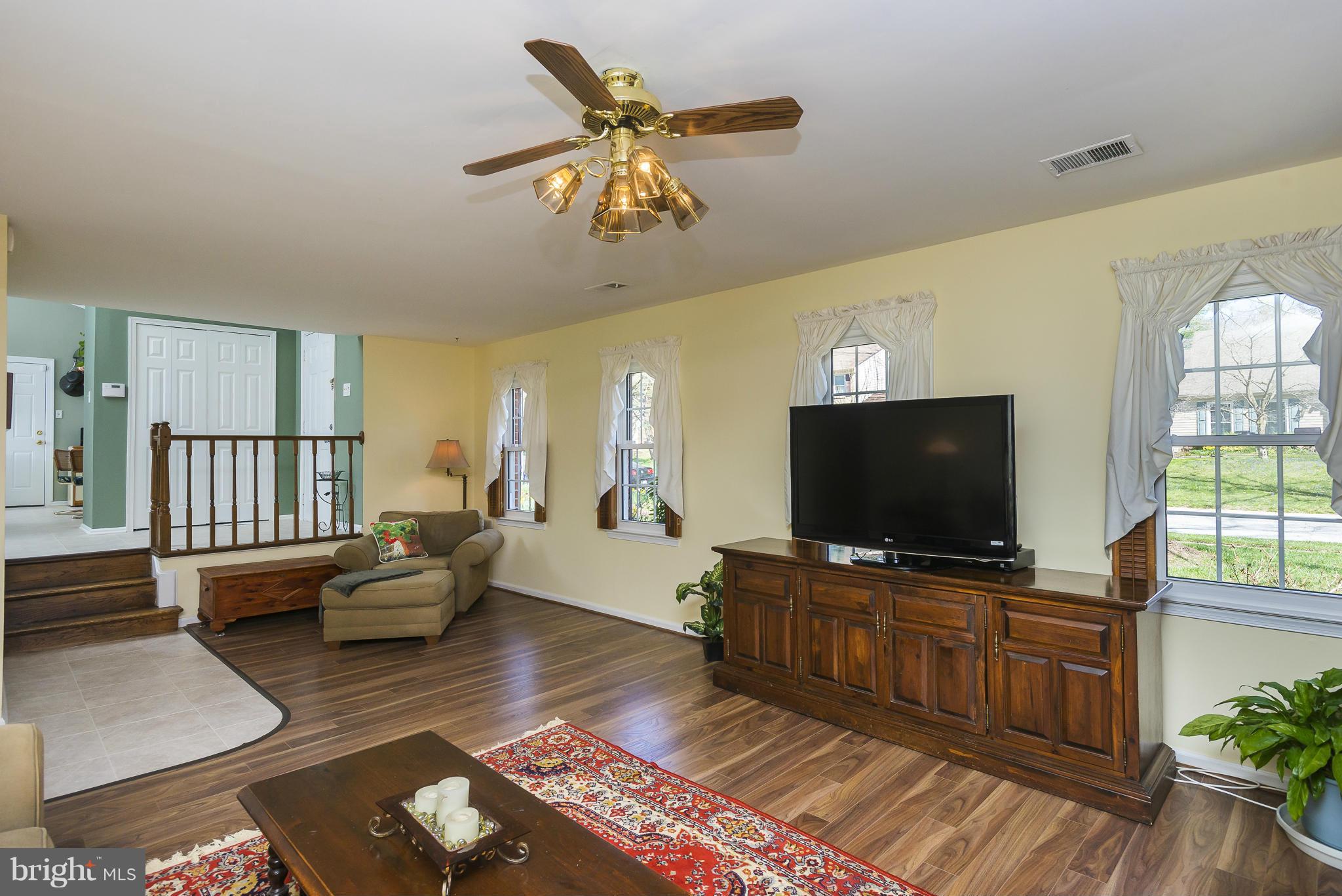 5054 Whetstone Road Columbia, MD 21044 - Photo 14 of 30 a living room with furniture and a flat screen tv