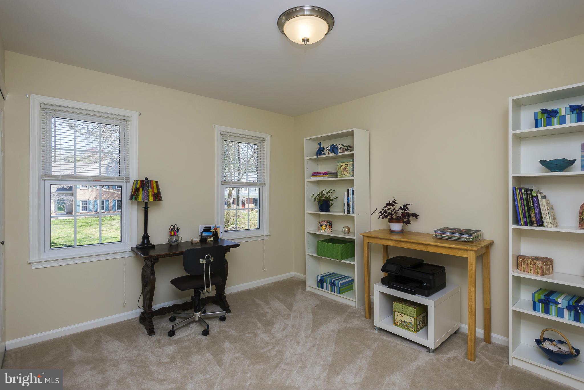 5054 Whetstone Road Columbia, MD 21044 - Photo 23 of 30 a view of a workspace with furniture and a window