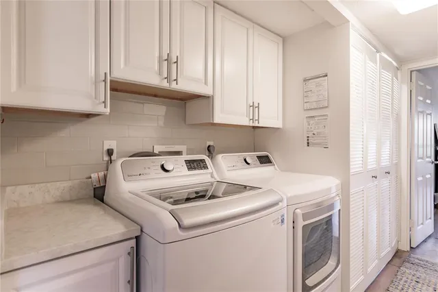 a utility room with dryer and washer