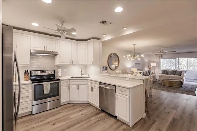 a kitchen with a stove and a sink